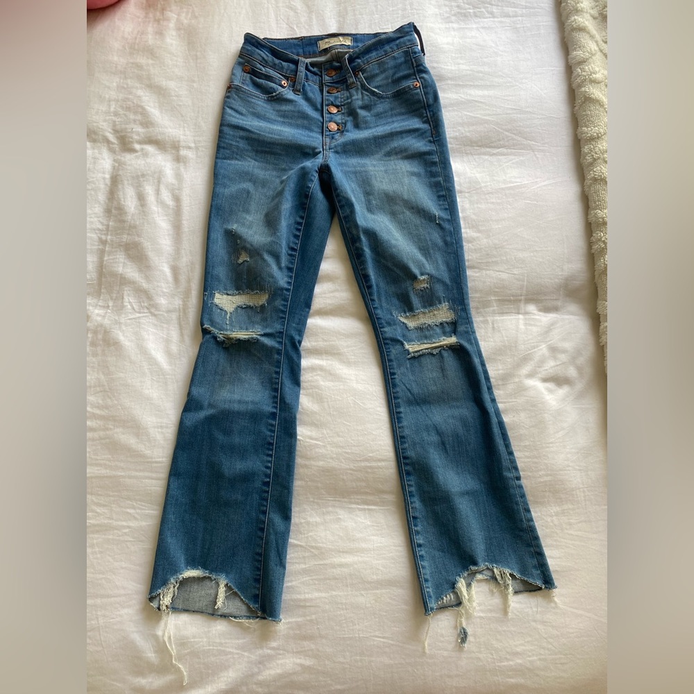 Madewell’s Cali-Demi Bootcut Distressed Button Fly blue jeans.